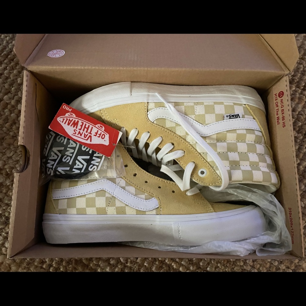 Vans new with tags. “Banana/marshmallow” checkerboard high tops. Men’s size 8